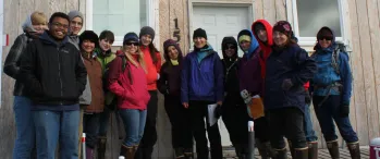 a group of people standing in front of a building