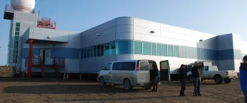 a group of people standing outside of a building